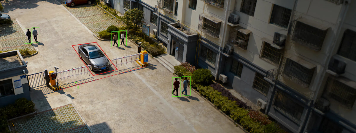 Pollo PLC-9845-AI-IR80/PM 8 Megapixel 45x AI PTZ Camera (800m IR) — aerial view of a car park with vehicles and people detected